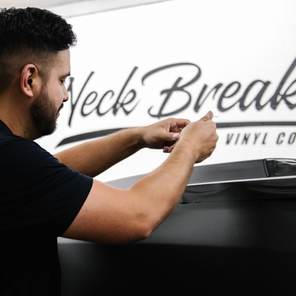 Owner Patric installing a wrap